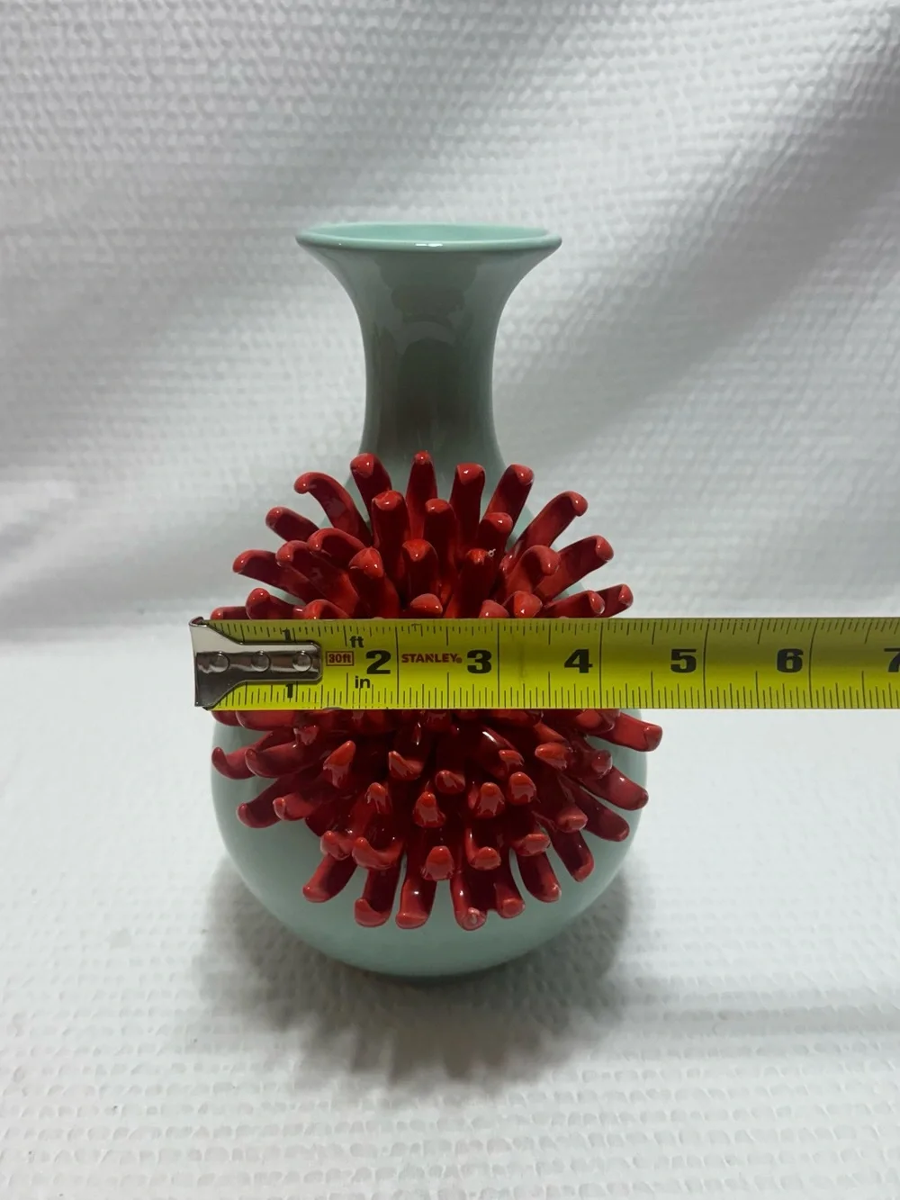 Anthropologie Ceramic Vase features a 3D red chrysanthemum bloom against a celad